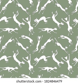 Seamless background of abstract silhouettes jumping and running white cats