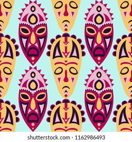 Seamless Background. African Seamless Pattern with Color Masks for Poster or Banner. Ethnic Seamless Pattern with Color Trible Shamanic Masks for your Design. Vector Texture.