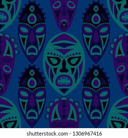 Seamless Background. African Seamless Pattern with Color Masks for Textile or Paper. Ethnic Seamless Pattern with Color Trible Shamanic Masks for your Design. Vector Texture.