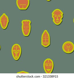 Seamless background with African ritual masks for your design