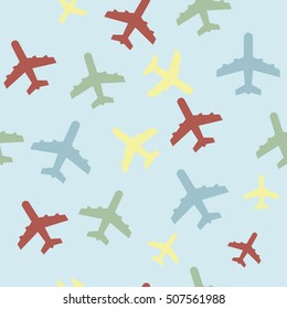 seamless background with airplanes in different colors on blue background 