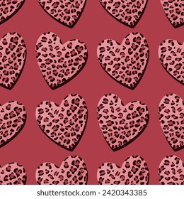 Seamless background with animal pattern hearts. Leopard-spotted heart.