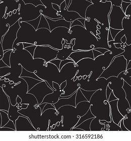 Seamless background with bats. Cartoon. Hand lettering: Boo!