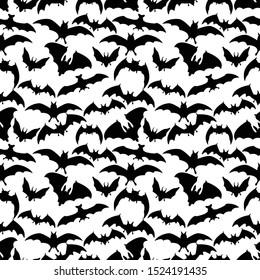 Seamless background with bats for Halloween greetings. Vector illustration with wild flying creatures. Monochrome seamless pattern with soaring bats on a white background for decoration on Halloween.