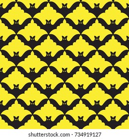 Seamless background with bats on the yellow background. Graphic seamless pattern.