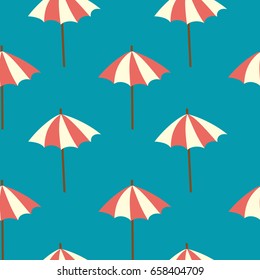 Seamless background with beach umbrellas on a turquoise background.