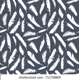 Seamless background with bird feathers.