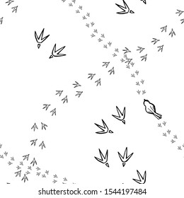Seamless background with bird's tracks. Monochrome hand drawn texture.