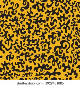 seamless background with black blots on bright yellow canvas