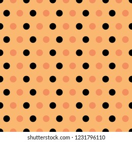 seamless background of black and salmon colored polka dots on apricot