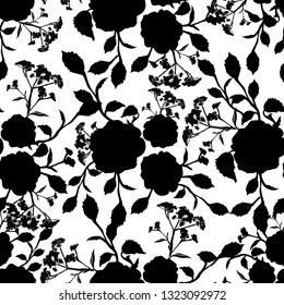 Seamless background of black and white silhouettes of flowers and leaves. Stylish exquisite pattern for dresses, packaging, tableware