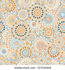 Seamless background of blue, orange and red color in in Arabic style. Mandala ornament.