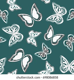 Seamless background from bright butterflies. Beautiful colorful butterflies chaotically fly. Seamless multicolored background with flying moths. Suitable for fabric, paper, packaging.