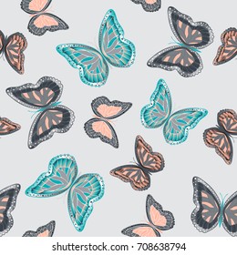 Seamless background from bright butterflies. Beautiful colorful butterflies chaotically fly. Seamless multicolored background with flying moths. Suitable for fabric, paper, packaging.