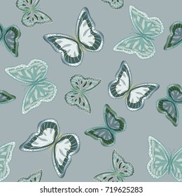 Seamless background from bright butterflies. Beautiful butterflies chaotically fly. Seamless background with flying moths. Suitable for fabric, paper, packaging.