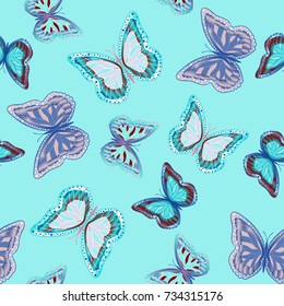 Seamless background from bright butterflies. Beautiful colorful butterflies chaotically fly. Seamless multicolored background with flying moths. Suitable for fabric, paper, packaging.