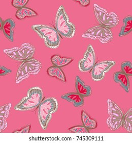 Seamless background from bright butterflies. Beautiful colorful butterflies chaotically fly. Seamless multicolored background with flying moths. Suitable for fabric, paper, packaging.