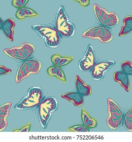 Seamless background from bright butterflies. Beautiful colorful butterflies chaotically fly. Seamless multicolored background with flying moths. Suitable for fabric, paper, packaging.