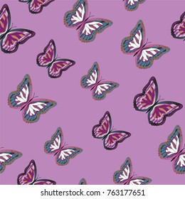 Seamless background from bright butterflies. Beautiful colorful butterflies chaotically fly. Seamless multicolored background with flying moths. Suitable for fabric, paper, packaging.