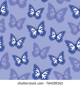 Seamless background from bright butterflies. Beautiful colorful butterflies chaotically fly. Seamless multicolored background with flying moths. Suitable for fabric, paper, packaging.