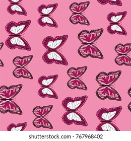 Seamless background from bright butterflies. Beautiful colorful butterflies chaotically fly. Seamless multicolored background with flying moths. Suitable for fabric, paper, packaging.