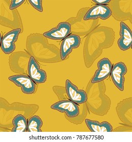 Seamless background from bright butterflies. Beautiful colorful butterflies chaotically fly. Seamless multicolored background with flying moths. Suitable for fabric, paper, packaging.