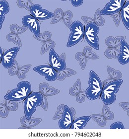 Seamless background from bright butterflies. Beautiful colorful butterflies chaotically fly. Seamless multicolored background with flying moths. Suitable for fabric, paper, packaging.