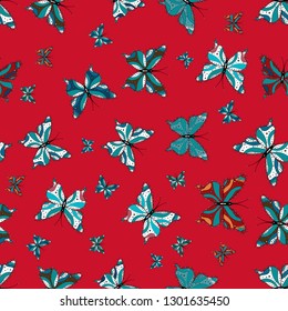 Seamless background from bright butterflies. Vector. Seamless multicolored background with flying moths. Beautiful colorful butterflies chaotically fly on white, blue and red colors.