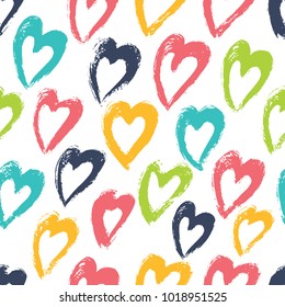 Seamless background with bright hearts. The pattern is drawn with a dry brush.