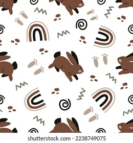 Seamless background with brown rabbits, abstraction. Vector background for kids