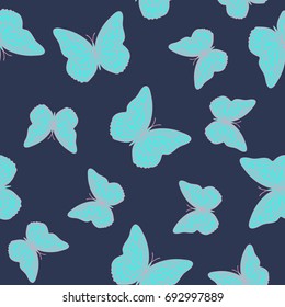 Seamless background from butterflies. Beautiful butterflies chaotically fly randomly. Vector. Suitable for fabric, paper, packaging.