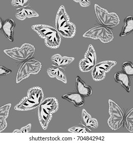 Seamless background from butterflies. Beautiful butterflies chaotically fly randomly. Vector. Suitable for fabric, paper, packaging.