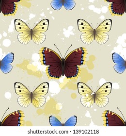 Seamless background with butterflies and paint splashes