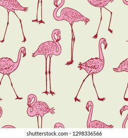 Seamless background of the cartoon pink flamingos