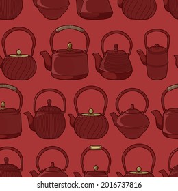 El fondo es impecable. Teteras de hierro fundido. Ceremonia del té asiático. Teteras de kars de diferentes formas sobre un fondo rojo. 