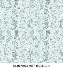 Seamless background with christmas gift socks on light blue background. Can be used for wallpaper, pattern fills, textile, web page background, surface textures