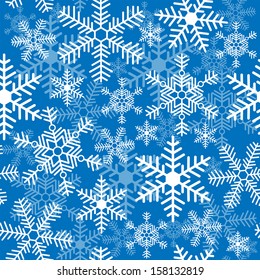 Seamless background with a Christmas snowflakes
