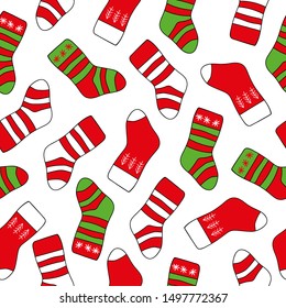 Seamless background Christmas Socks on the white background. New Year and Christmas background with bright striped socks of red and green color.