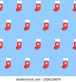Seamless background Christmas Socks on the blue background. New Year and Christmas background with red socks 