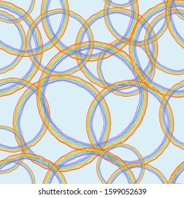 Seamless background, circles, and rainbow colors. Blue background. Perfect for invitations, postcards, decor, kids celebrations, and more.