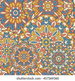 Seamless background with circular symmetrical mandalas. Ethnic pattern in Greek, Turkish, Islamic style.