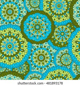 Seamless background with circular symmetrical mandalas. Texture to print on fabric, Wallpaper, clothes.