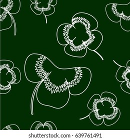 Seamless background with clover leaves