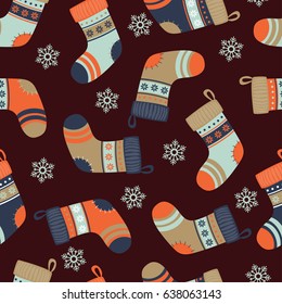 Seamless background with colored Christmas socks. Pattern.