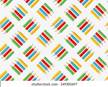 Seamless background with colored pencils in four colors, illustration on the theme of school
