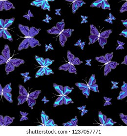 Seamless background of colorful butterflies. Nice background for design of fabric, paper, wrappers and wallpaper. Vector illustration.