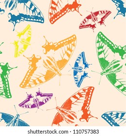 Seamless background of colorful butterflies. Vector illustration.