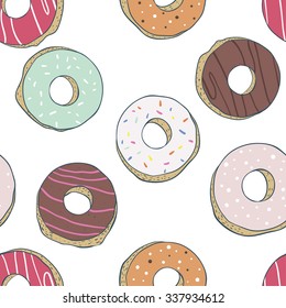 Seamless background of colorful donuts glazed.