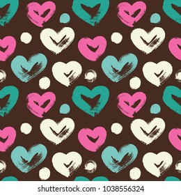 Seamless background with colorful hearts. Hand drawn paint pattern. 