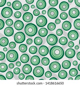 Seamless background of concentric circles in neon green colors on gray. Retro pattern, inspired by the 60s.